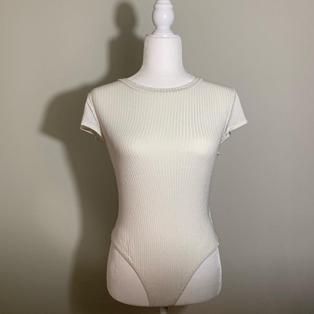 Off white ribbed bodysuit-Clasp on bottom. Worn 2x